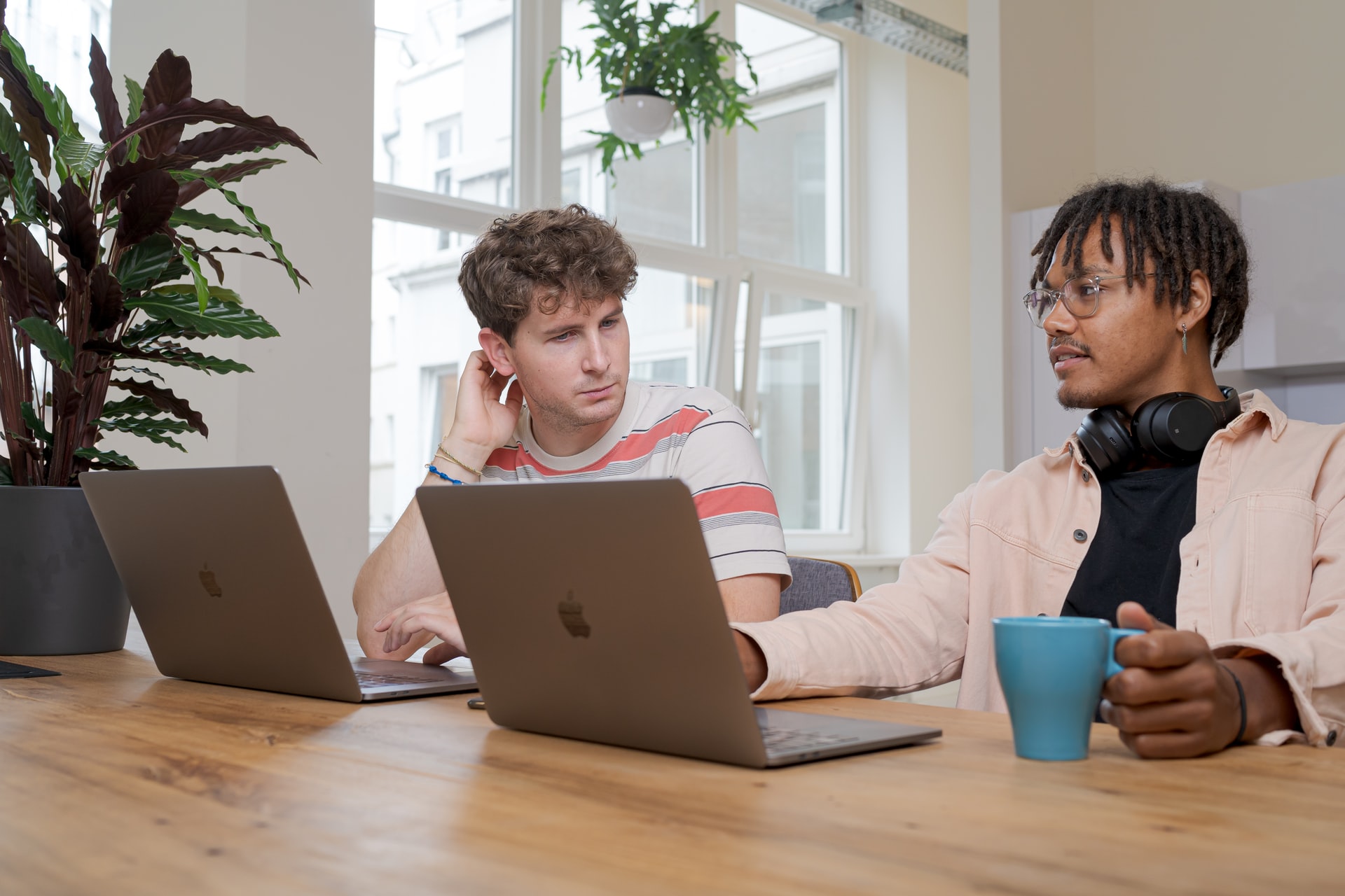 Two men with their laptops